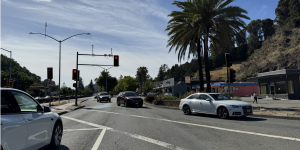 Cars pass through a busy intersection.